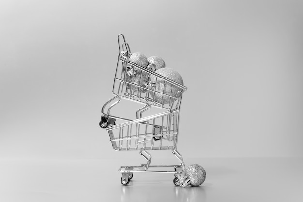 Free Photo silver aesthetic wallpaper with shopping cart