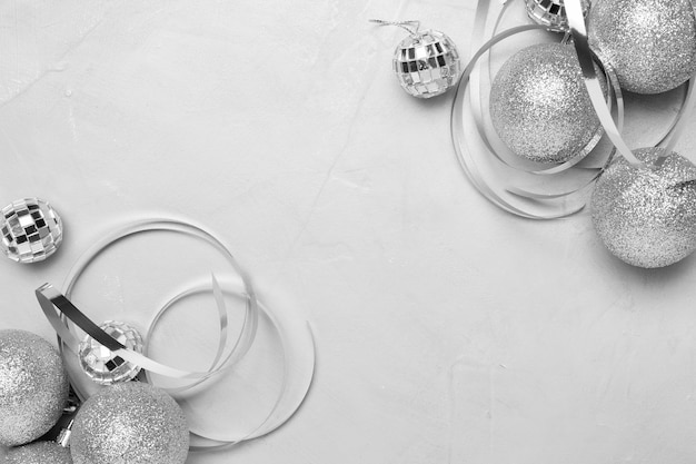 Free photo silver christmas ornaments on white table