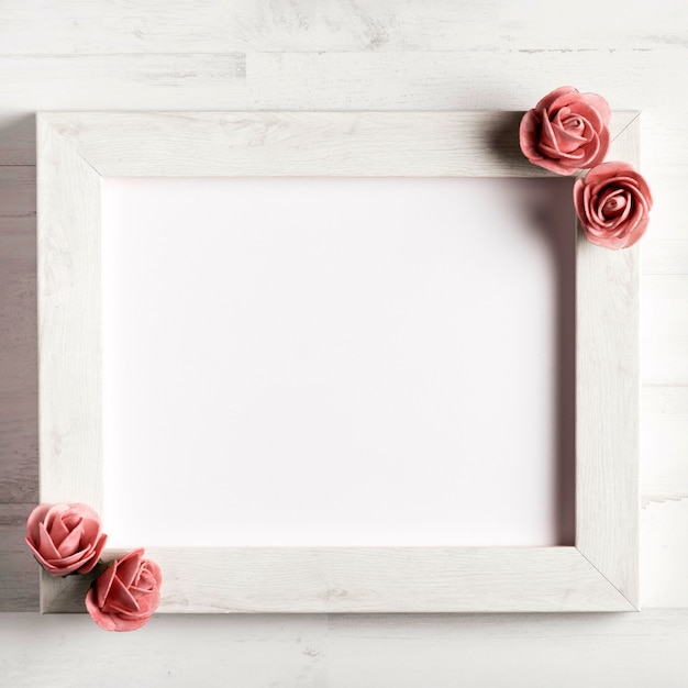 Free photo simple blank wooden frame with roses