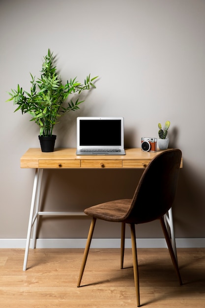 Simple wood desk with chair and laptop