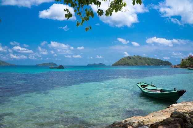 Single boat in the sea under a beautiful cloudy sky