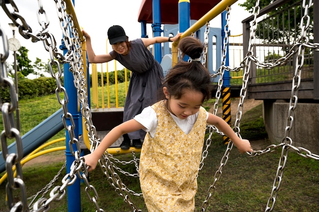 Single mom playing with her daughter in a park