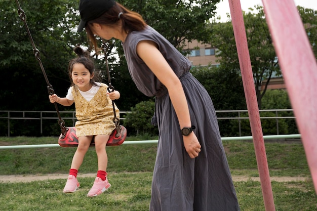 Free Photo single mom playing with her daughter