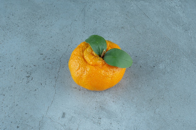 Free Photo a single of ripe tangerine , on the marble background. high quality photo