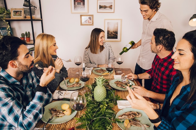 Six friends having a dinner