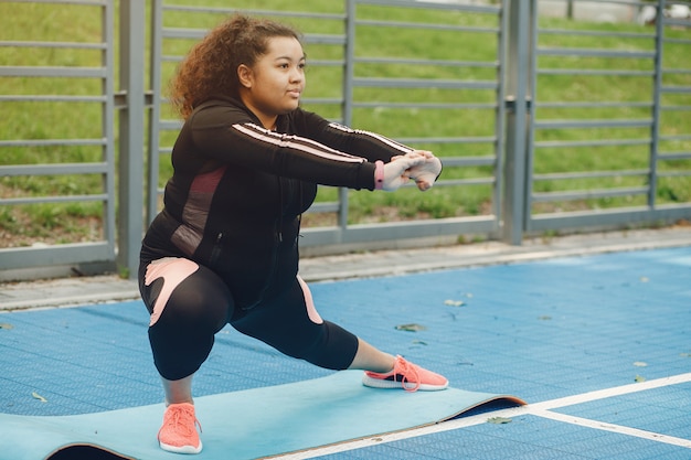 Over the size of a woman doing stretching exercises