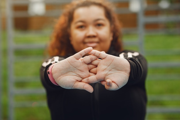 Free photo over the size of a woman doing stretching exercises