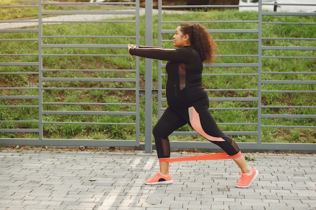 Free photo over the size of a woman doing stretching exercises