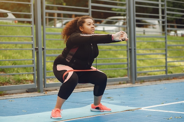 Free photo over the size of a woman doing stretching exercises