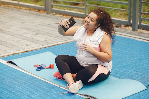 Free photo over the size of a woman doing stretching exercises