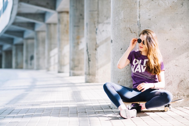 Skateboarder girl with sunglasses