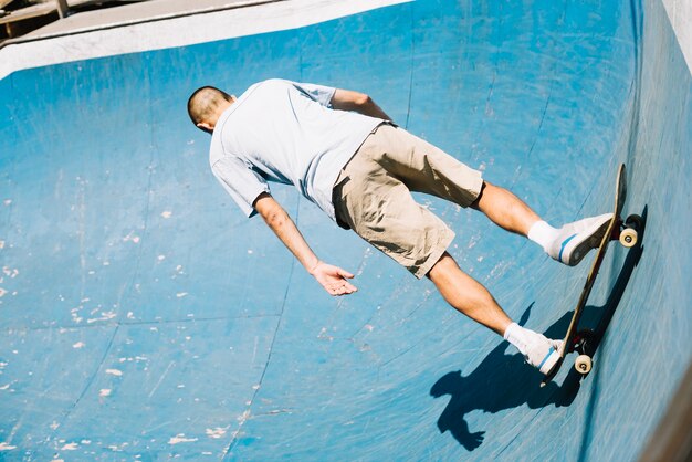 Skateboarder practicing in skatepark