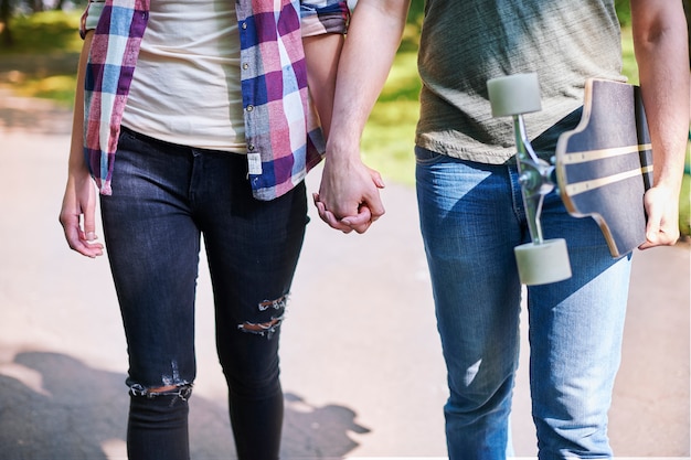 Skater couple enjoying in the park