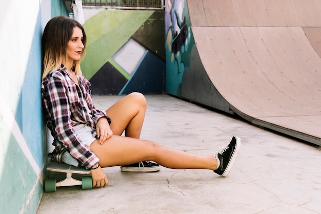 Skater girl chilling on board