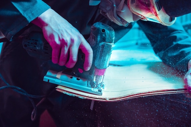 Skater in process of making his own skateboard longboard  open business concept