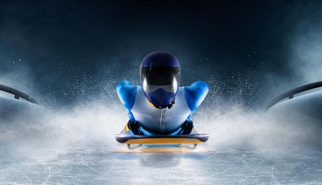 Skeleton sport Bobsled Luge The athlete descends on a sleigh on an ice track