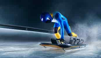 Free photo skeleton sport bobsled luge the athlete descends on a sleigh on an ice track