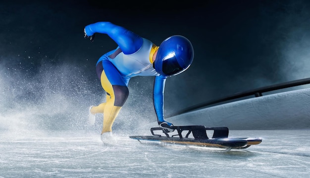 Free photo skeleton sport bobsled luge the athlete descends on a sleigh on an ice track