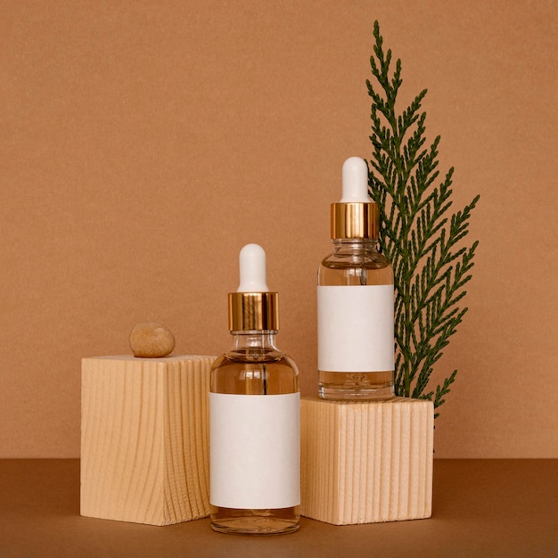 Free Photo skin oil droppers assortment with wooden pieces