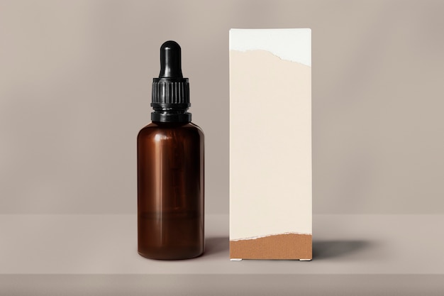 Free Photo skincare glass bottle with box beauty product packaging