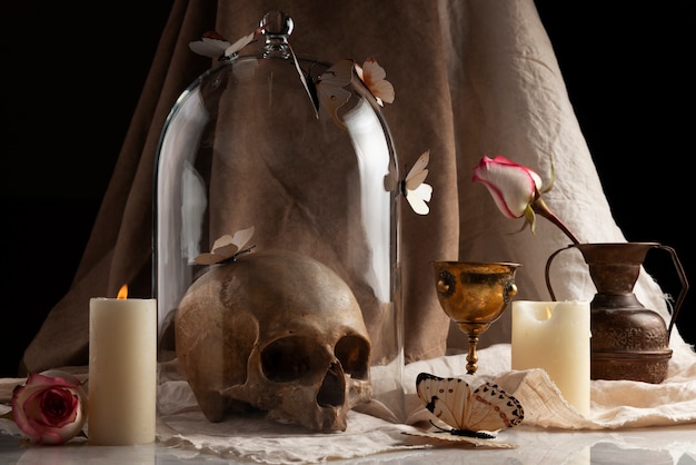 Free Photo skull and candle arrangement still life