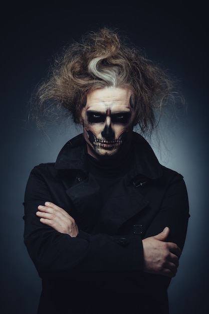 Free Photo skull makeup portrait of young man