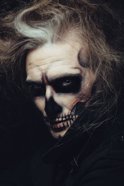 Free Photo skull makeup portrait of young man