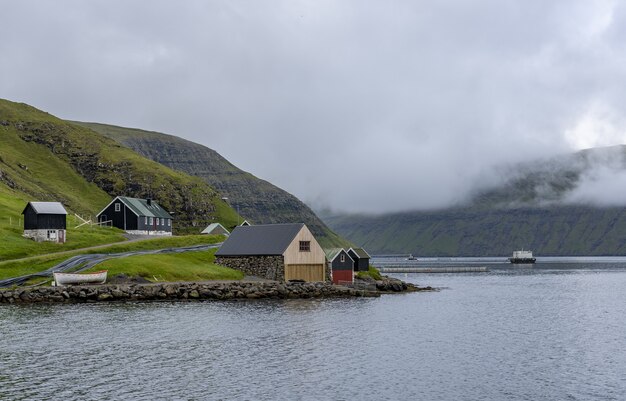 Sky and houses on the shore in the Faroe Islands