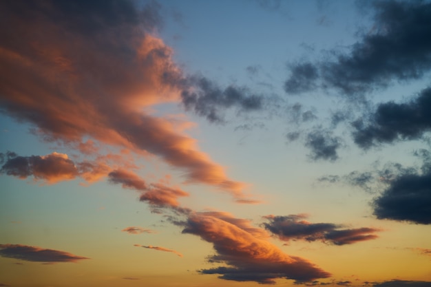 Sky with dark clouds and oranges at sunset