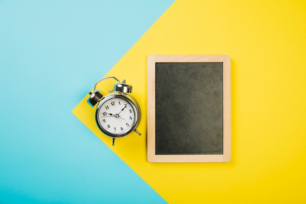 Slate next to alarm clock