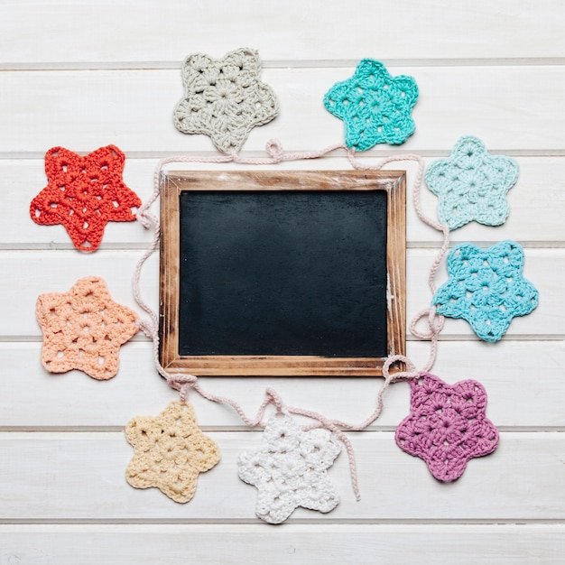 Free photo slate and wool stars forming circle