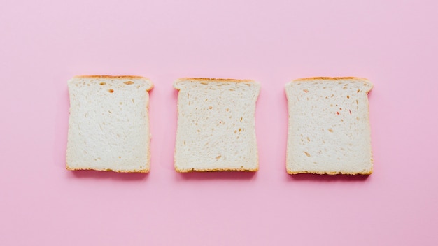 Free photo slice of bread with color background