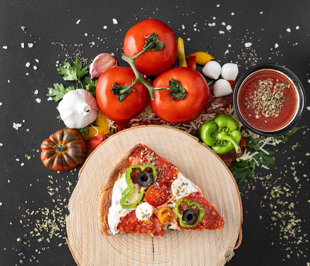 Slice of pizza on wooden board