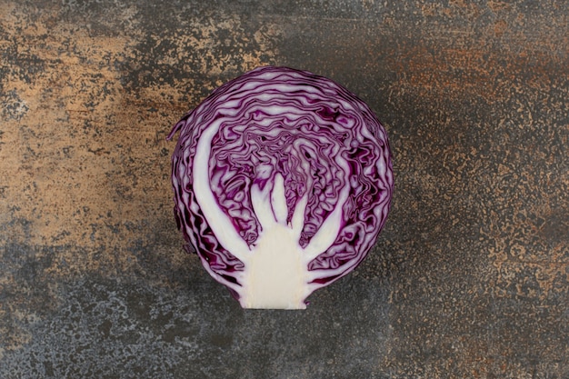 A slice of red cabbage on the marble surface