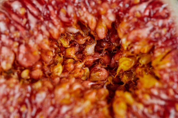 Slice of ripe fig with seeds. Close up.