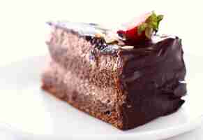 Free photo slice of tasty chocolate cake with strawberry on top