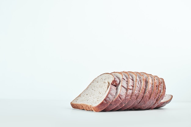 Sliced bread on grey table.