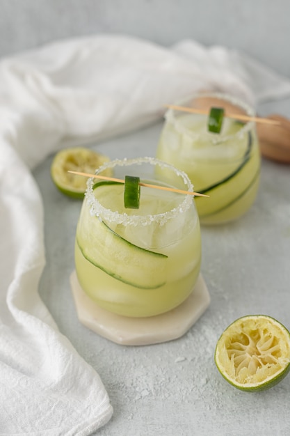 Sliced green apple fruit on white textile