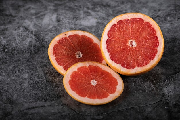 Sliced juicy fresh grapefruit on a marble