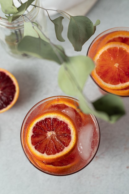 Sliced orange fruit on white textile