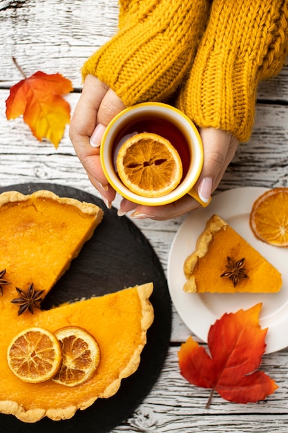 Sliced pumpkin pie and cup of tea