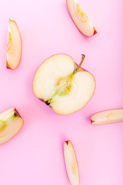 Slices of apple and half of apple