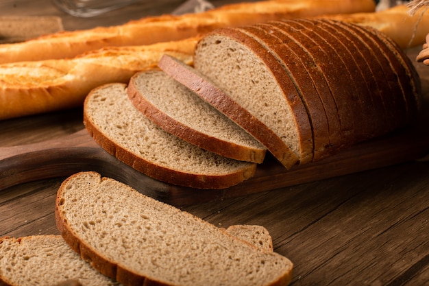 Slices of brown bread with french baguette