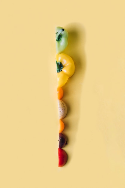 Free Photo slices of colorful vegetables on yellow background