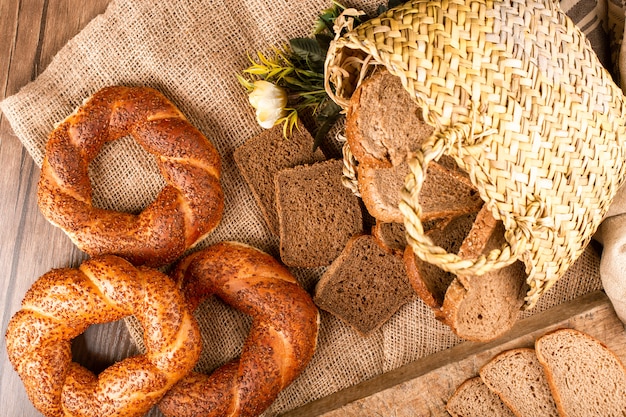 Slices of dark and white bread in box with tasty turkish bagels