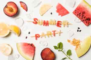 Free photo slices of fruits between ice and summer party title