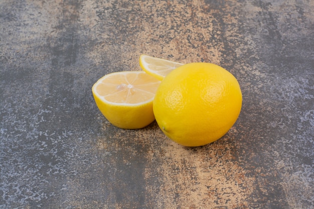 Slices of lemon on marble space