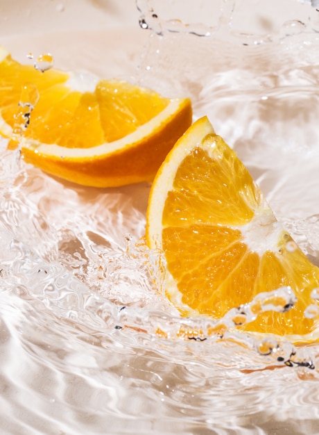 Free Photo slices of an orange in water