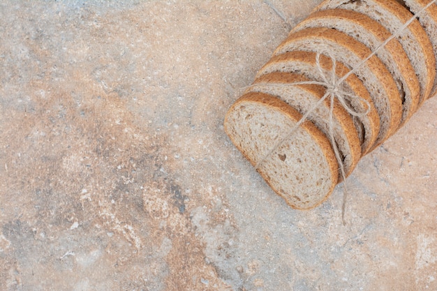 Slices of rye bread on marble surface