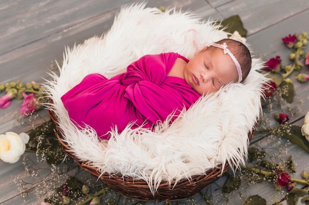 Small baby in pink blanket